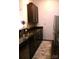 This kitchen showcases stainless steel appliances, granite countertops, and dark wood cabinetry at 2116 Mcclintock Rd, Charlotte, NC 28205