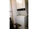 Compact laundry room features a stacked washer and dryer unit with vintage look at 2116 Mcclintock Rd, Charlotte, NC 28205