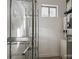 Small laundry room features metal shelving, a small window, and a compact washer and dryer set at 2116 Mcclintock Rd, Charlotte, NC 28205