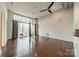 Open living space featuring high ceilings, hardwood floors, and large windows with a balcony view at 2116 Mcclintock Rd, Charlotte, NC 28205