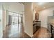 Open floor plan with hardwood floors, large windows, balcony, and a view of the kitchen area at 2116 Mcclintock Rd, Charlotte, NC 28205