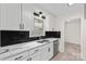 Renovated kitchen with white shaker cabinets, stainless steel appliances, and quartz countertops at 2312 Roland Dr, Monroe, NC 28110