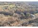 Expansive aerial view showcasing the secluded home surrounded by lush trees, offering privacy and a serene environment at 252 Big Lick Rd, Stanfield, NC 28163