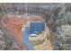 An aerial view of the home nestled into a private wooded lot with long driveway at 252 Big Lick Rd, Stanfield, NC 28163