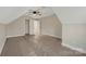 Unfinished bedroom with ceiling fan, grey walls, beige carpet and plastic floor coverings at 252 Big Lick Rd, Stanfield, NC 28163