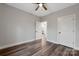 Neutral bedroom with ceiling fan, vinyl floors, and interior doors visible at 252 Big Lick Rd, Stanfield, NC 28163