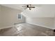 Spacious unfinished bedroom with vaulted ceiling, ceiling fan and window at 252 Big Lick Rd, Stanfield, NC 28163