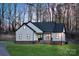 Charming exterior view showcasing the modern farmhouse design with black trim and inviting entrance at 252 Big Lick Rd, Stanfield, NC 28163