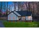 Charming exterior view showcasing the modern farmhouse design with black trim and inviting entrance at 252 Big Lick Rd, Stanfield, NC 28163