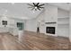 Bright open-concept living area with hardwood floors, fireplace and vaulted ceilings at 252 Big Lick Rd, Stanfield, NC 28163