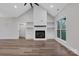 Living room with modern fireplace, built-in shelving and large windows for great natural light at 252 Big Lick Rd, Stanfield, NC 28163