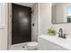 Modern bathroom with dark tile shower and white vanity at 2525 Oxford Cir, Lancaster, SC 29720