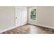 Bright bedroom with wood-look floors and ample natural light at 2525 Oxford Cir, Lancaster, SC 29720