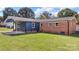 Rear view of home with patio and side yard at 2525 Oxford Cir, Lancaster, SC 29720