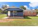 Rear view of home showcasing patio and brick details at 2525 Oxford Cir, Lancaster, SC 29720