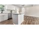 Modern kitchen with white cabinets, granite island, and stainless steel appliances at 2525 Oxford Cir, Lancaster, SC 29720