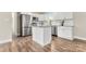 Modern kitchen with white cabinets, granite countertops, and stainless steel appliances at 2525 Oxford Cir, Lancaster, SC 29720