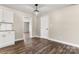 Bright kitchen features white cabinets, granite countertops, and wood-look floors at 2525 Oxford Cir, Lancaster, SC 29720