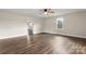 Hardwood floor living room with neutral wall colors and access to other rooms at 2525 Oxford Cir, Lancaster, SC 29720
