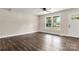 Living room with hardwood floors and large window at 2525 Oxford Cir, Lancaster, SC 29720