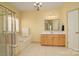 Bathroom with soaking tub, shower, and updated vanity at 2534 Old Ashworth Nw Ln, Concord, NC 28027