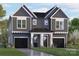 Gray two-story house with a black roof and a two-car garage at 3621 Rogers St, Charlotte, NC 28208