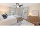 Bright bedroom with hardwood floors and ceiling fan at 4237 Darwin Cir, Charlotte, NC 28209