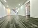 Large basement with gray vinyl plank flooring and recessed lighting at 4513 Munsee St, Charlotte, NC 28213