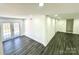 Open concept basement with gray vinyl plank flooring and French doors at 4513 Munsee St, Charlotte, NC 28213