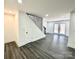 Finished basement with gray vinyl plank flooring and French doors at 4513 Munsee St, Charlotte, NC 28213
