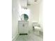 Small modern bathroom with white vanity and marble flooring at 4513 Munsee St, Charlotte, NC 28213