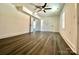 Large bedroom with double doors and grey wood-look flooring at 4513 Munsee St, Charlotte, NC 28213