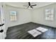 Bright bedroom with hardwood floors and ceiling fan at 4513 Munsee St, Charlotte, NC 28213