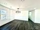 Spacious dining area with hardwood floors and chandelier at 4513 Munsee St, Charlotte, NC 28213