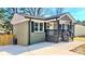 Charming house featuring a covered porch, modern paint, and new concrete sidewalk at 4513 Munsee St, Charlotte, NC 28213