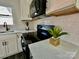 Stylish kitchen details, including hexagonal backsplash and quartz countertops at 4513 Munsee St, Charlotte, NC 28213