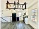 Modern kitchen with white cabinetry, stainless steel appliances, and contemporary lighting at 4513 Munsee St, Charlotte, NC 28213