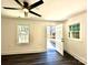 Living room with backyard access and grey wood-look flooring at 4513 Munsee St, Charlotte, NC 28213