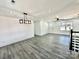 Bright living room with hardwood floors and modern light fixture at 4513 Munsee St, Charlotte, NC 28213