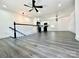 Open living room with hardwood floors and modern lighting at 4513 Munsee St, Charlotte, NC 28213