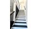 Modern staircase with black and white railings at 4513 Munsee St, Charlotte, NC 28213