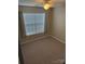 Bright bedroom with large window, ceiling fan, and carpet at 484 Lexie Ln, Rock Hill, SC 29732
