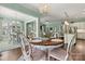 Open concept dining area with round table and chairs, and views to kitchen and living room at 4998 Looking Glass Trl, Denver, NC 28037