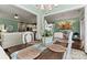Elegant dining room with rustic table, and view into the living room and kitchen at 4998 Looking Glass Trl, Denver, NC 28037