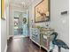 Bright and spacious entryway with hardwood floors and decorative console at 4998 Looking Glass Trl, Denver, NC 28037