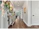 Long hallway with hardwood floors leading to the main living area at 4998 Looking Glass Trl, Denver, NC 28037