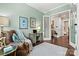 Light and airy home office with hardwood floors and large windows at 4998 Looking Glass Trl, Denver, NC 28037