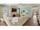 Spacious living room with fireplace, large sectional sofa and hardwood floors at 4998 Looking Glass Trl, Denver, NC 28037