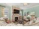 Spacious living room with stone fireplace, comfortable seating, and large windows at 4998 Looking Glass Trl, Denver, NC 28037