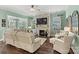 Relaxing living room with a stone fireplace and built-in shelving at 4998 Looking Glass Trl, Denver, NC 28037